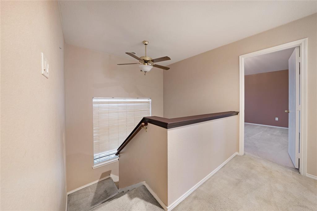 13241 Ridgepointe Road Fort Worth, TX 76244 - Photo 14 of 31 a view of a hallway with a ceiling fan