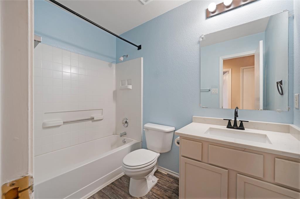 13241 Ridgepointe Road Fort Worth, TX 76244 - Photo 17 of 31 a bathroom with a sink a toilet and shower