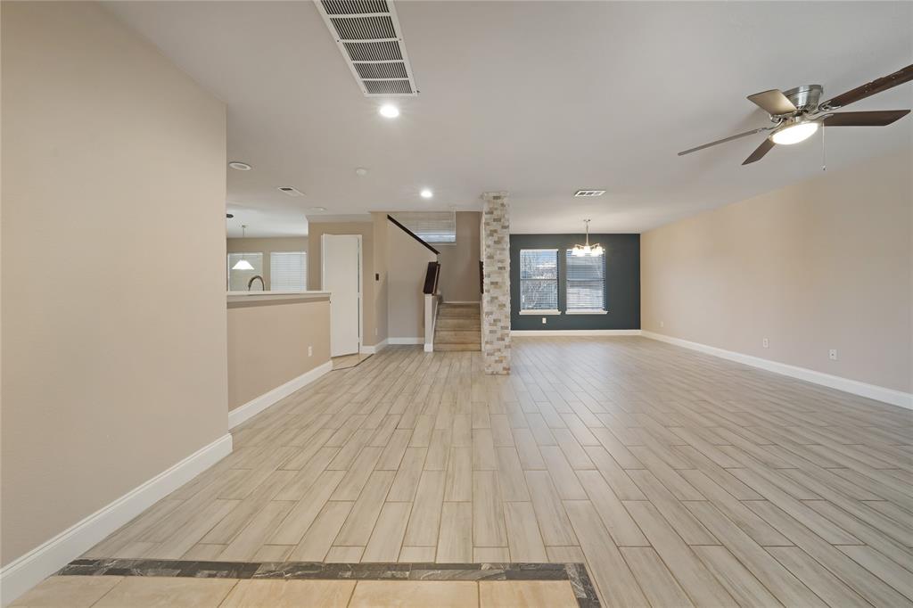 13241 Ridgepointe Road Fort Worth, TX 76244 - Photo 2 of 31 wooden floor in an empty room with a window