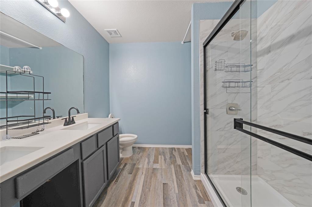 13241 Ridgepointe Road Fort Worth, TX 76244 - Photo 23 of 31 a bathroom with a sink and a mirror