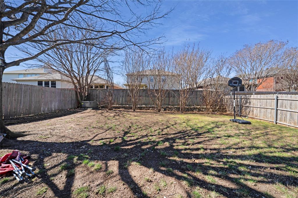 13241 Ridgepointe Road Fort Worth, TX 76244 - Photo 26 of 31 a view of a yard with a large tree