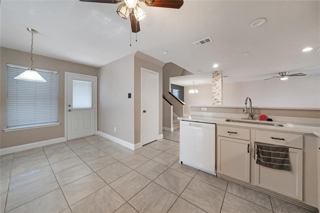 13241 Ridgepointe Road Fort Worth, TX 76244 - Photo 10 of 31 a kitchen with white cabinets and white appliances
