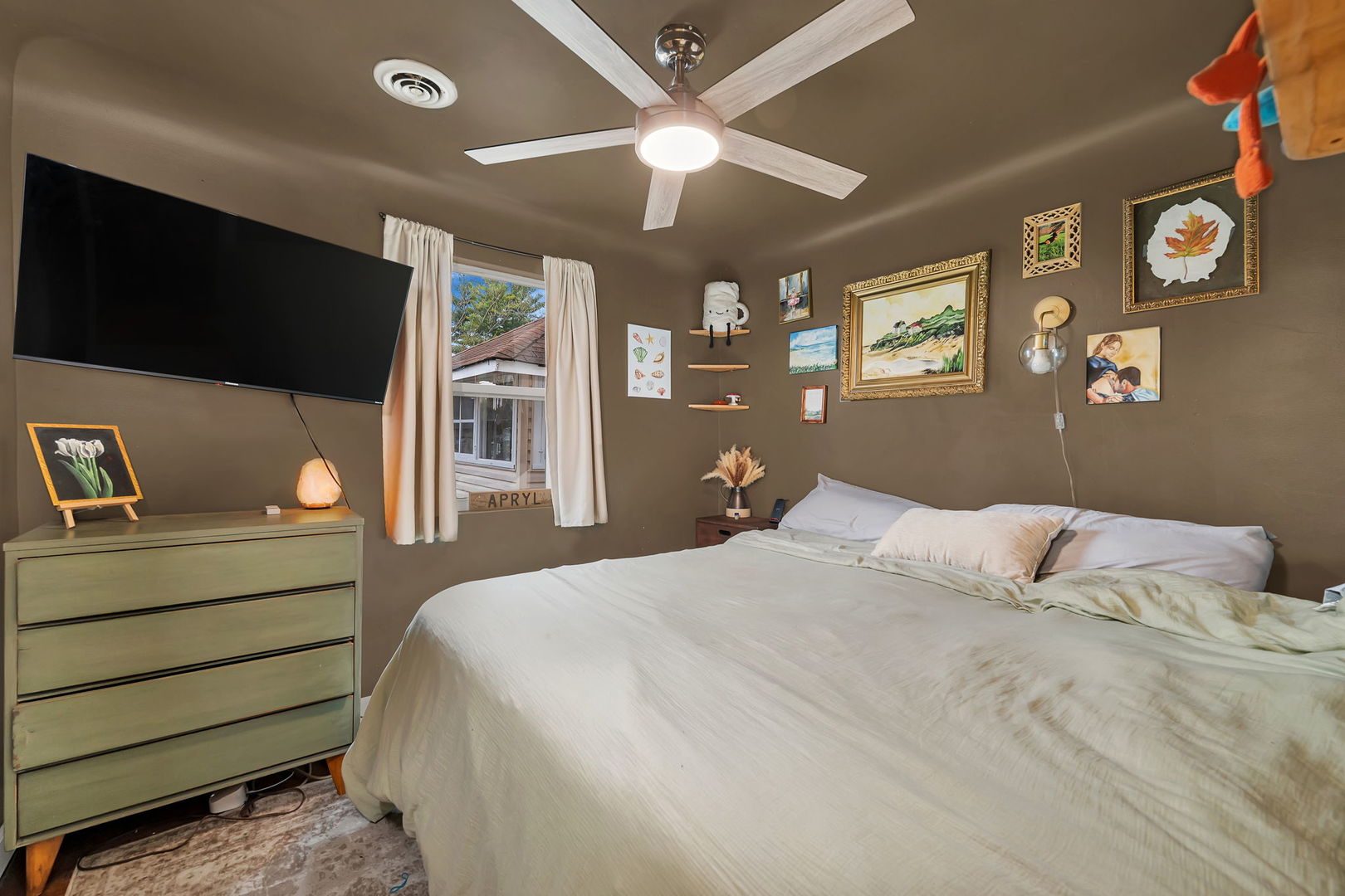 136 Grove Street Braidwood, IL 60408 - Photo 15 of 26 a bedroom with a bed and a flat screen tv