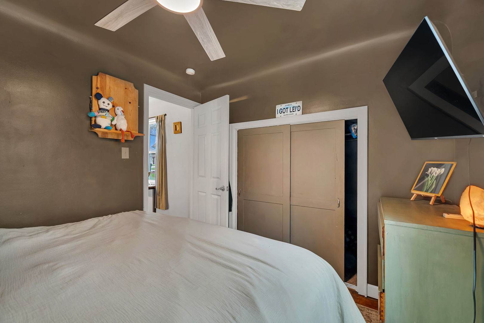 136 Grove Street Braidwood, IL 60408 - Photo 16 of 26 a bedroom with a bed and a television