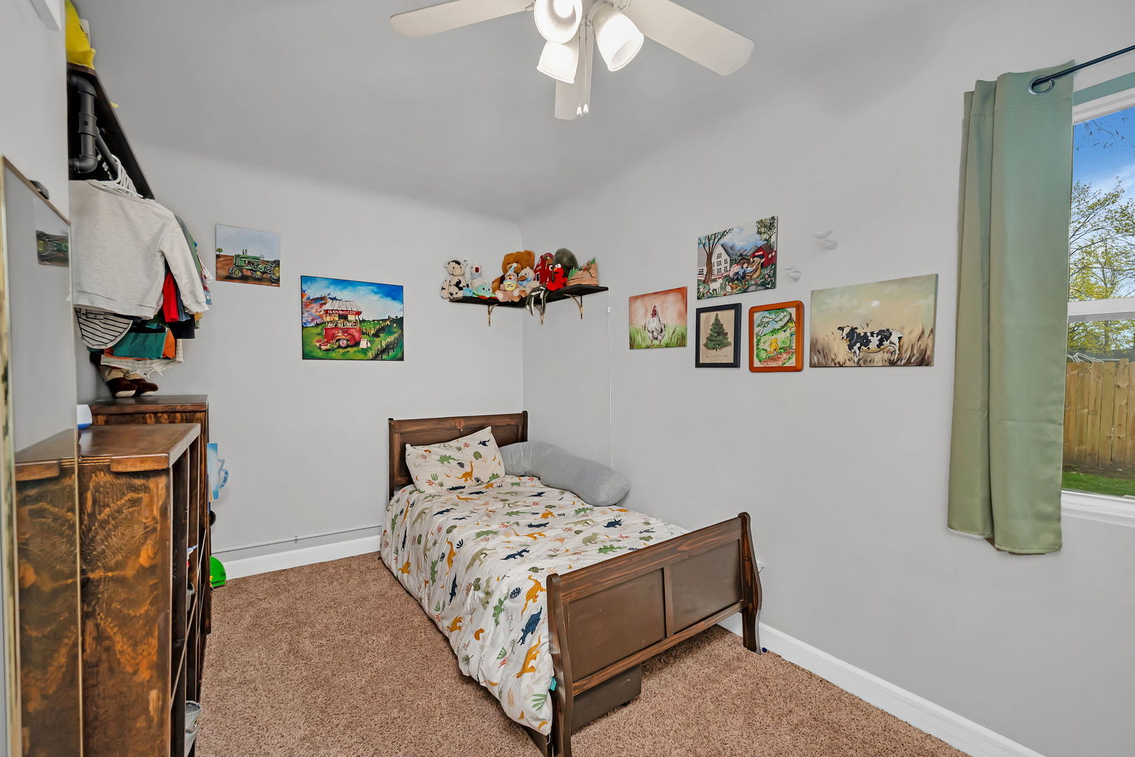 136 Grove Street Braidwood, IL 60408 - Photo 17 of 26 a bedroom with a bed and a chandelier