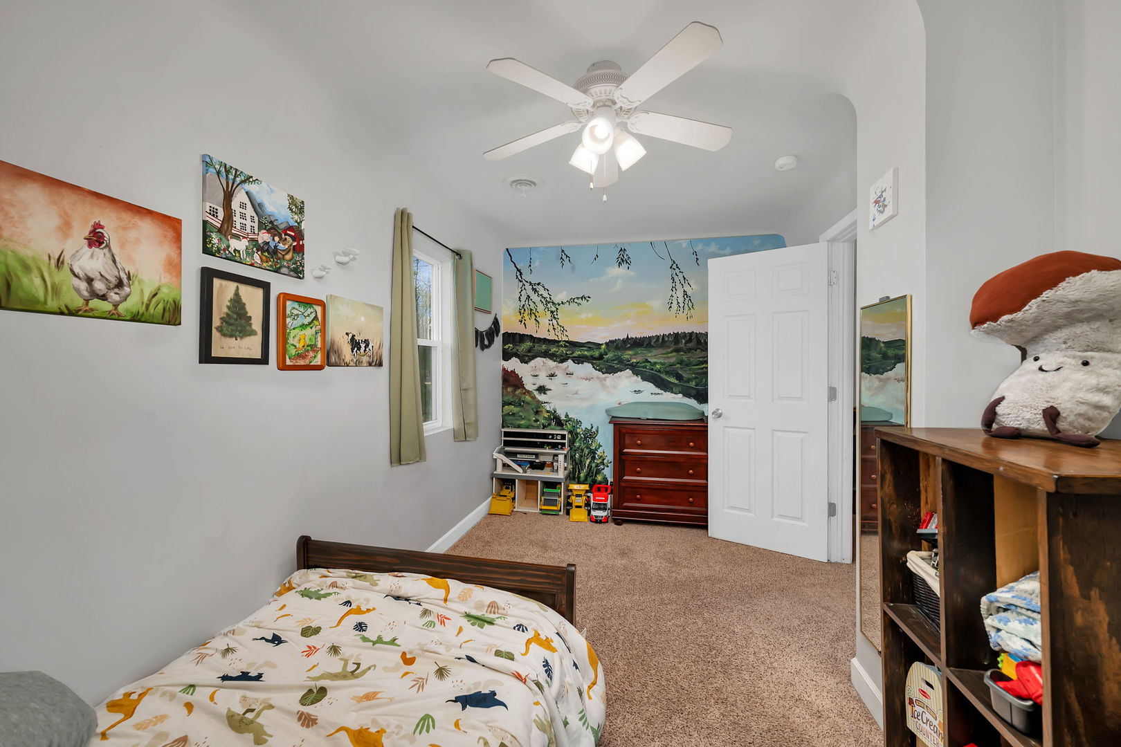 136 Grove Street Braidwood, IL 60408 - Photo 18 of 26 a bedroom with furniture and a chandelier