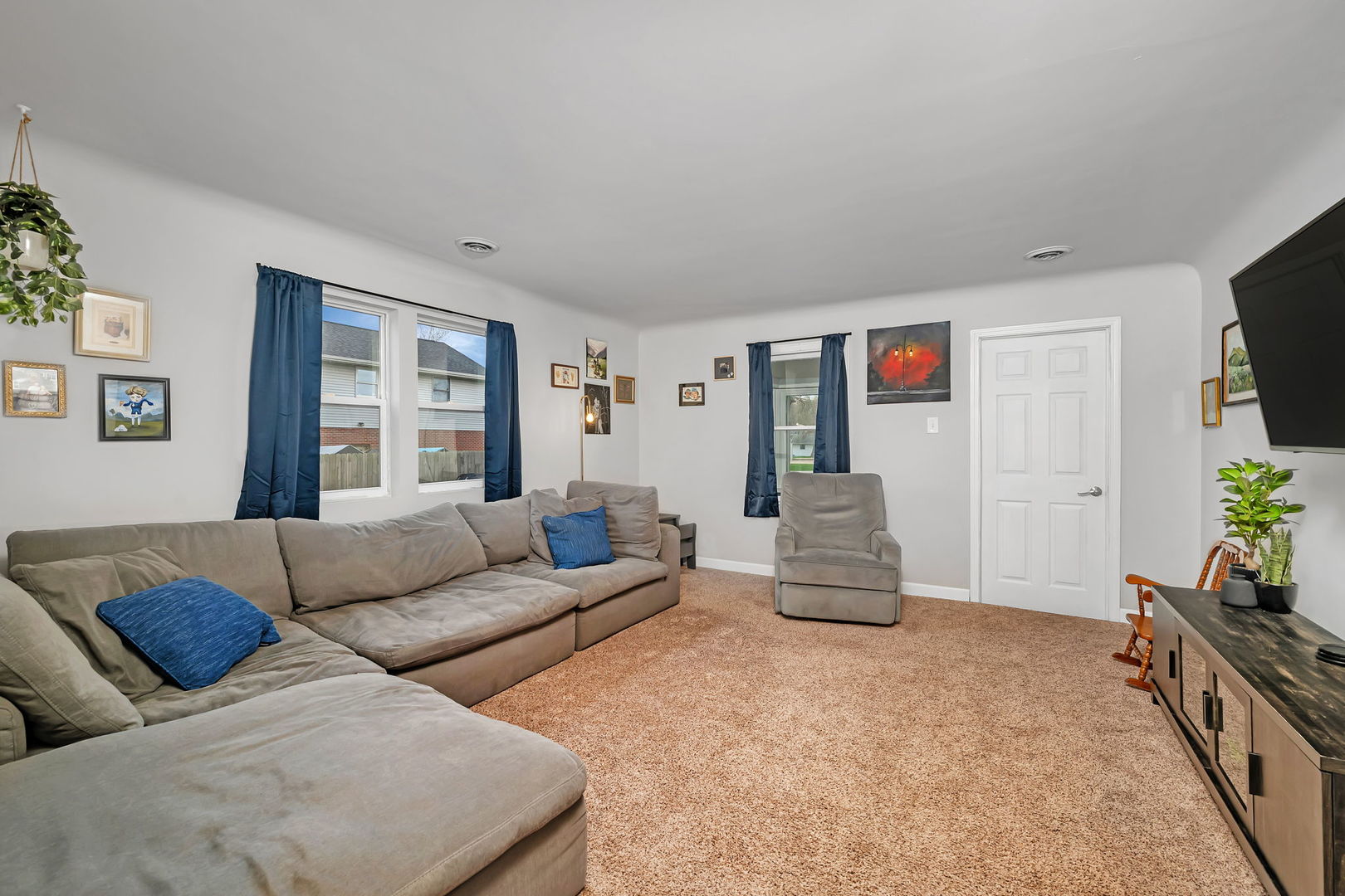 136 Grove Street Braidwood, IL 60408 - Photo 7 of 26 a living room with furniture and a flat screen tv