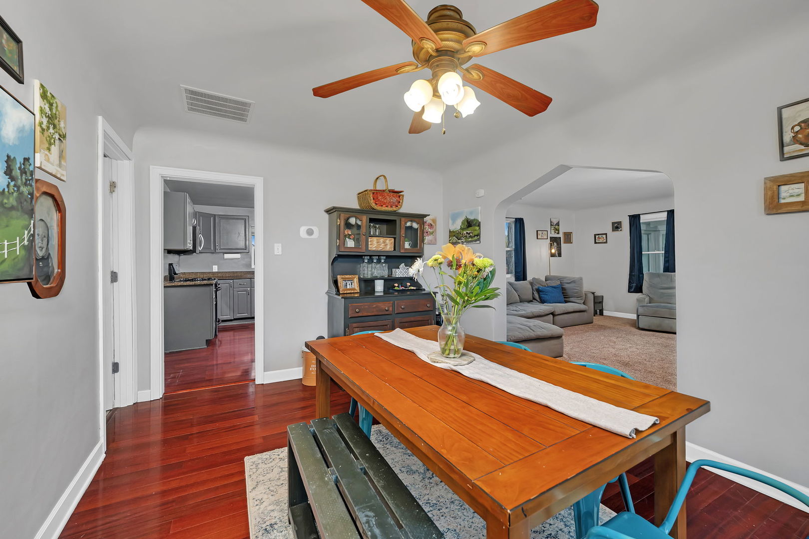 136 Grove Street Braidwood, IL 60408 - Photo 9 of 26 a room with wooden floor table and a chandelier