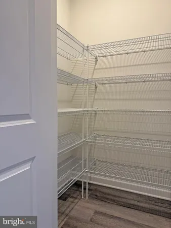 a bathroom with a granite countertop sink shower and a mirror