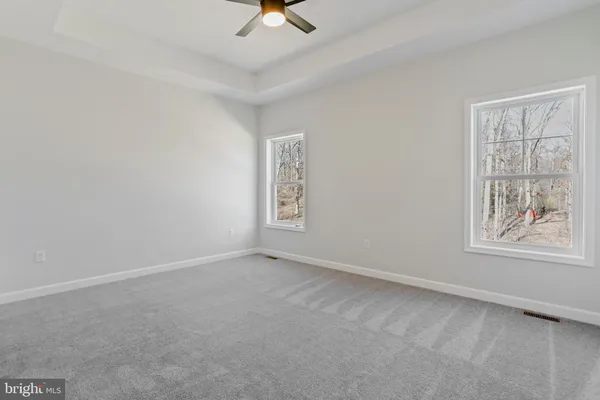 a bathroom with a double vanity sink mirror and