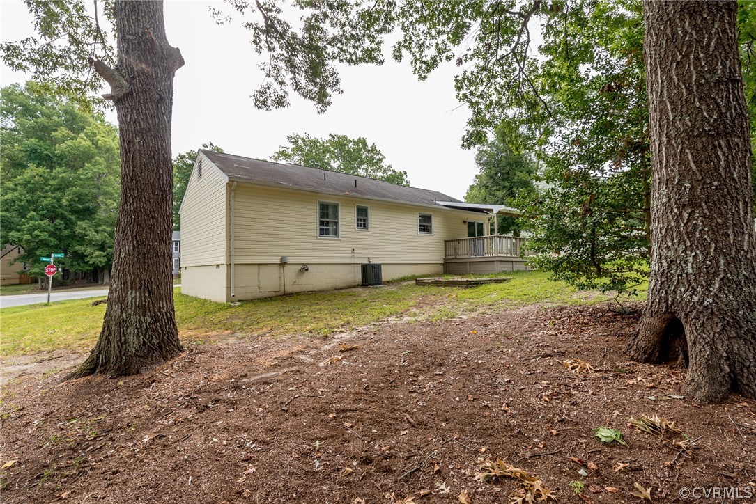 10600 Genlou Road Chesterfield, VA 23832 - Photo 28 of 28 a view of a house with backyard and a tree