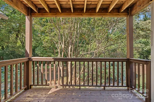 a porch with a yard in back