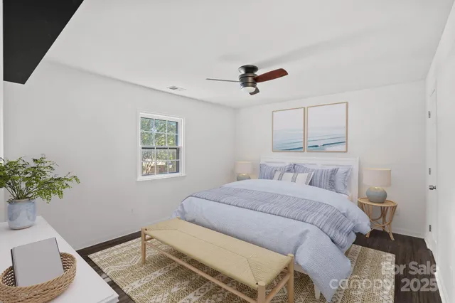 a bedroom with a bed and a couch