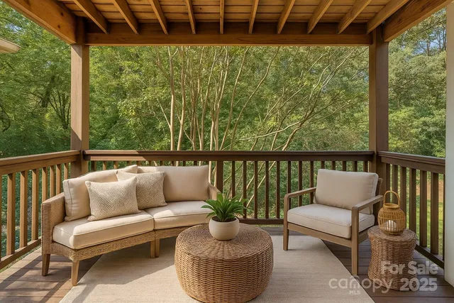 a balcony with furniture and a potted plant