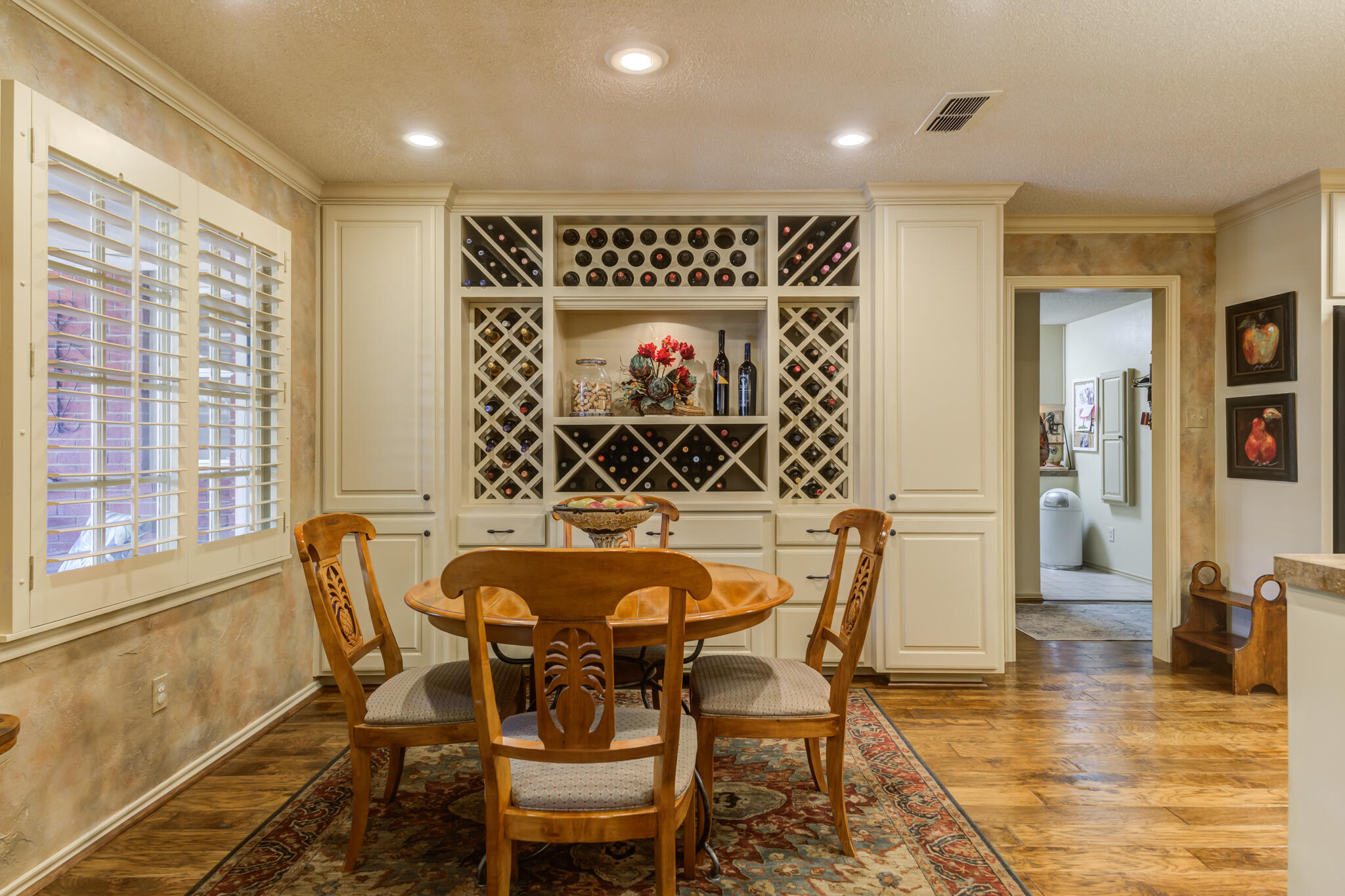 3614 68th Street Lubbock, TX 79413 - Photo 32 of 68 a view of a dining room with furniture and wooden floor