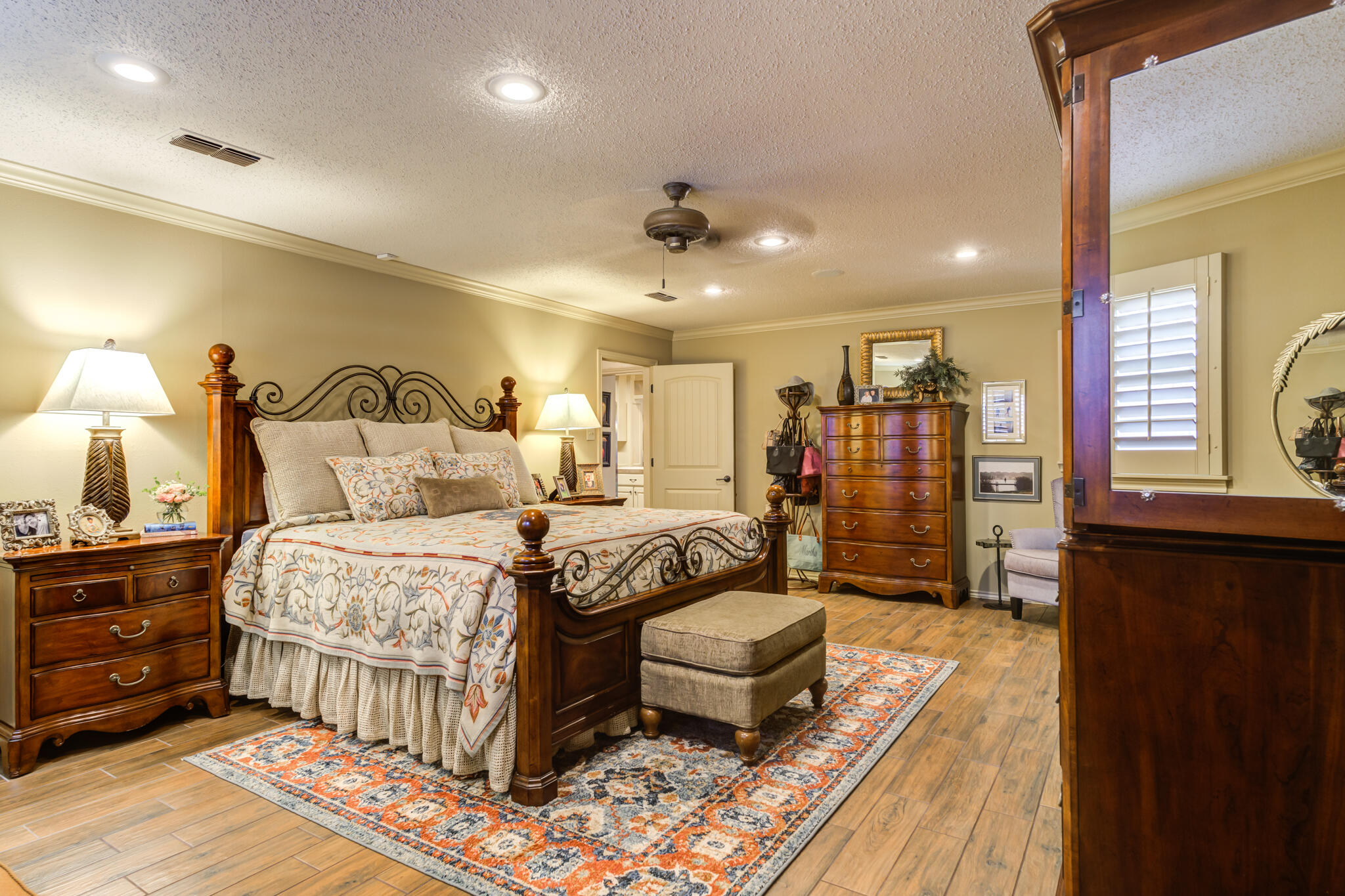 3614 68th Street Lubbock, TX 79413 - Photo 38 of 68 a bedroom with a bed a mirror and furniture