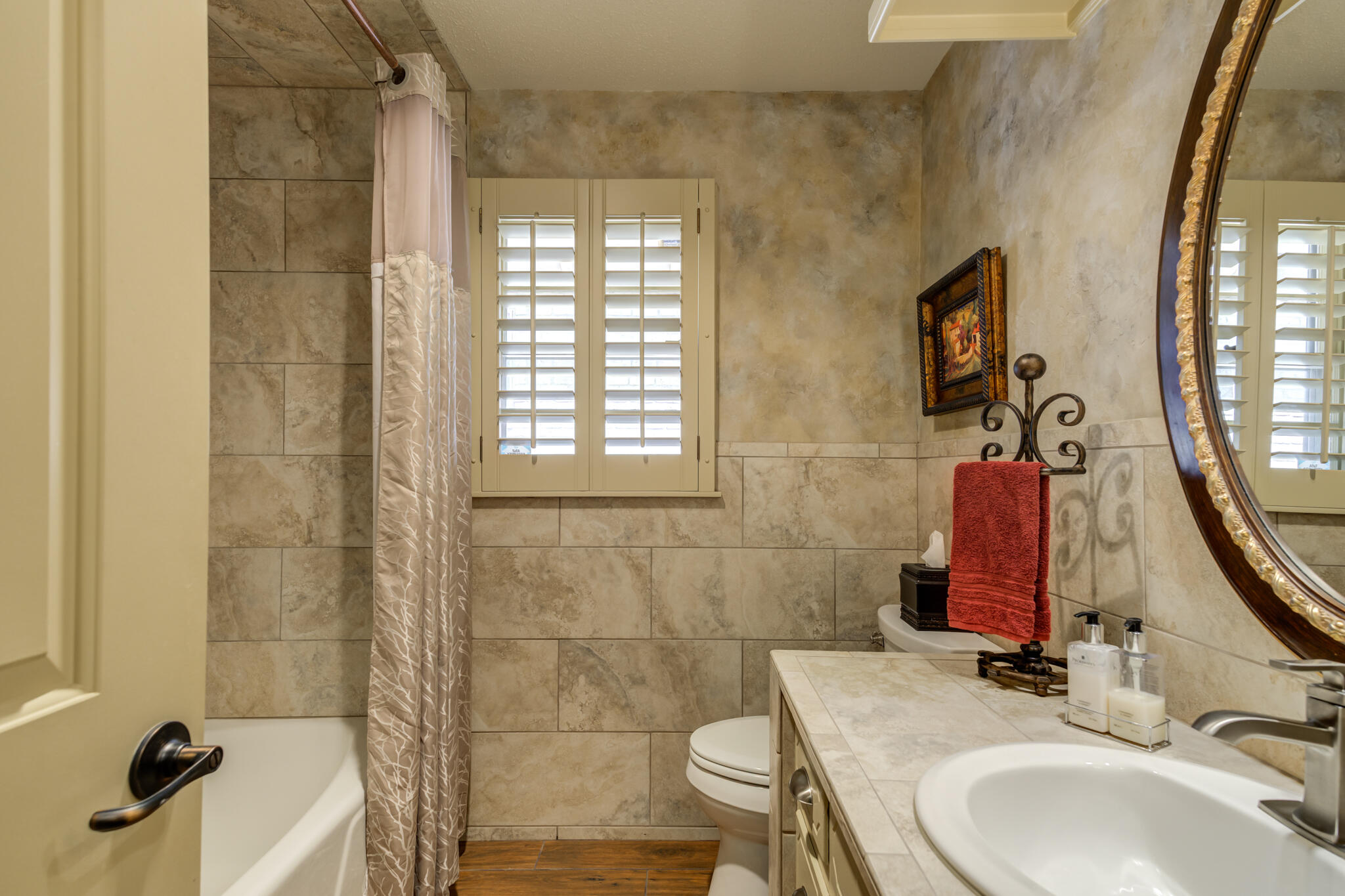 3614 68th Street Lubbock, TX 79413 - Photo 48 of 68 a bathroom with a sink and a mirror