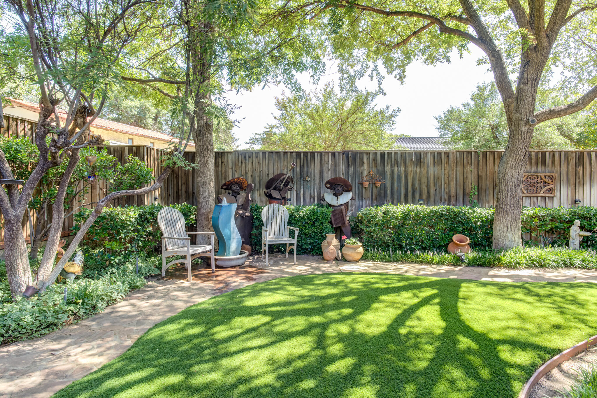 3614 68th Street Lubbock, TX 79413 - Photo 60 of 68 a view of a chair and table in backyard of the house