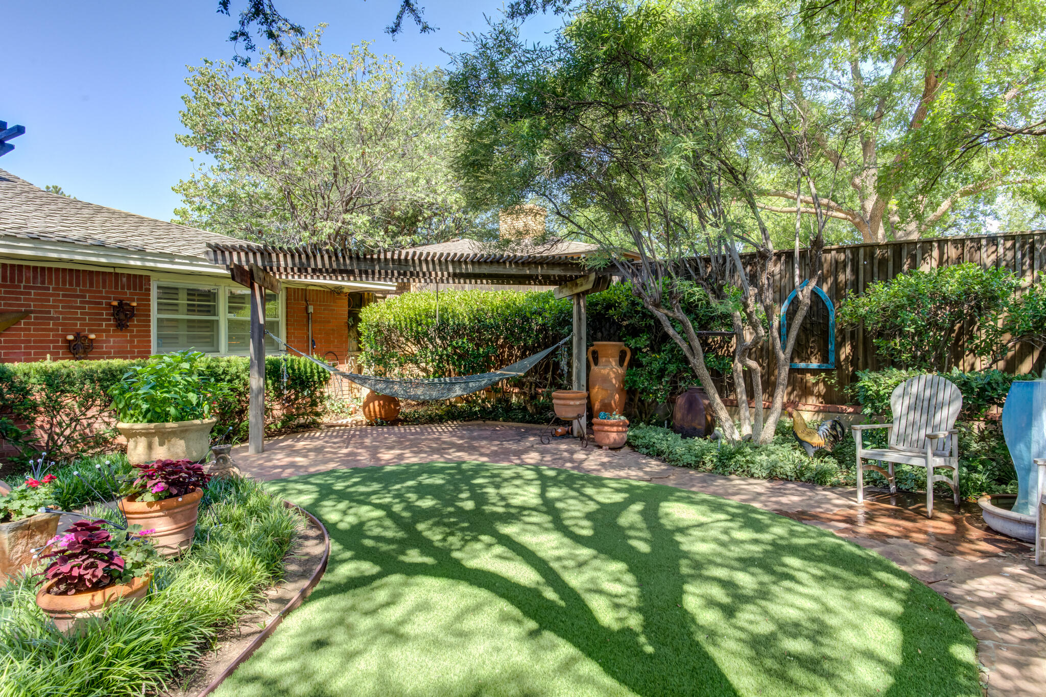 3614 68th Street Lubbock, TX 79413 - Photo 63 of 68 a view of a backyard with a garden and plants