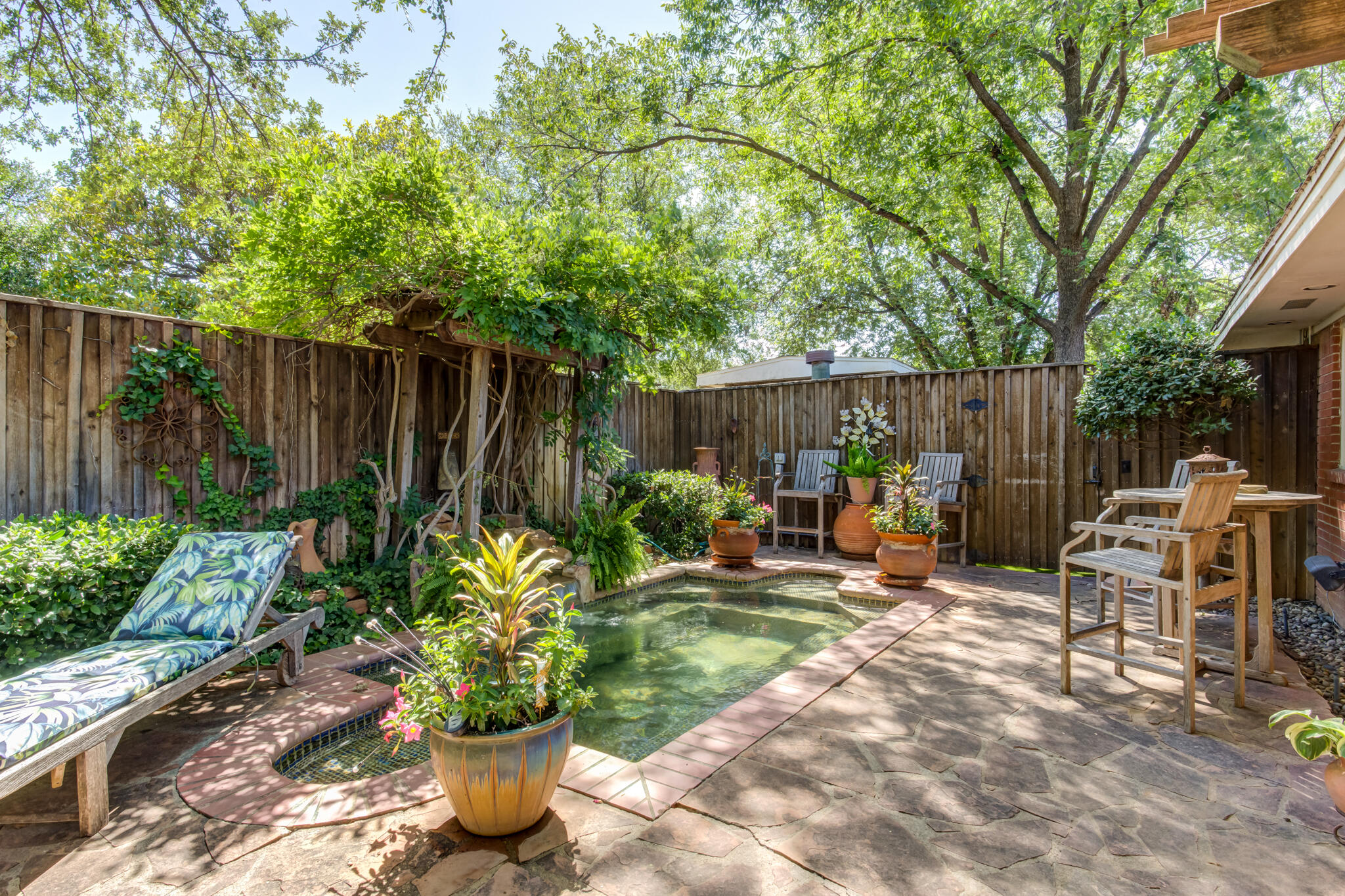 3614 68th Street Lubbock, TX 79413 - Photo 65 of 68 a view of a chairs and table in backyard of the house