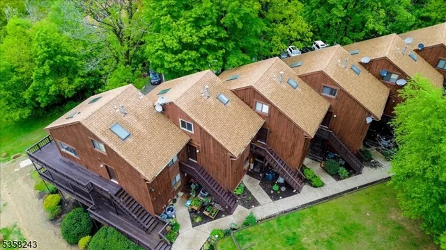 an aerial view of a house with a big yard