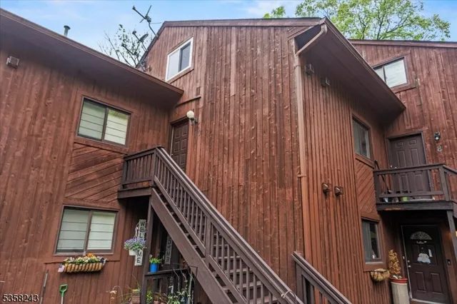 a view of balcony with wooden floor and stairs
