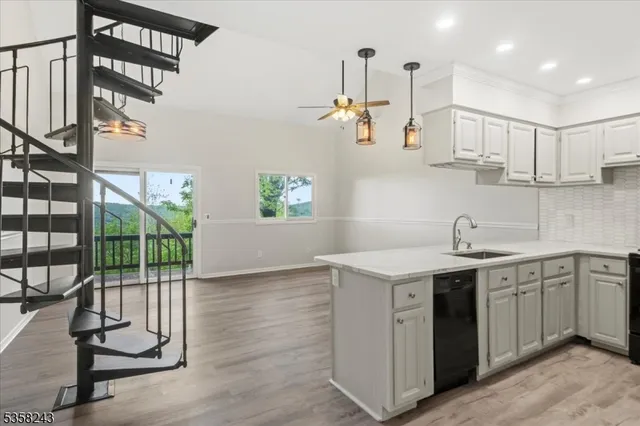 a kitchen with a sink cabinets and window
