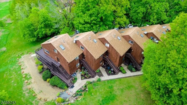 an aerial view of a house with a big yard