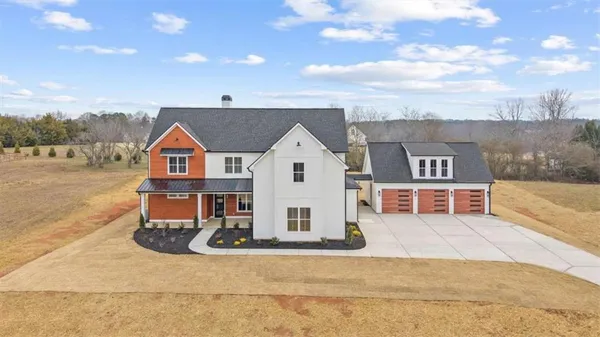 a view of house with yard
