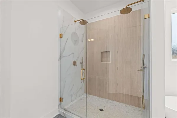 a view of a livingroom with a ceiling fan and window