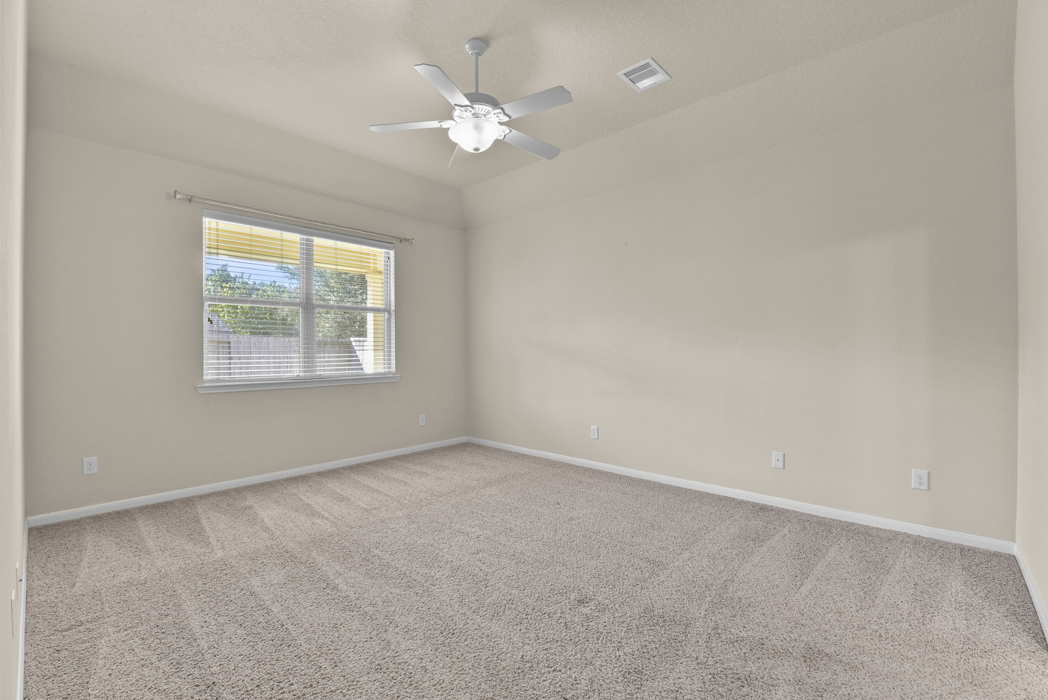 39 Butternut Grove Place Tomball, TX 77375 - Photo 21 of 35 an empty room with windows and fan