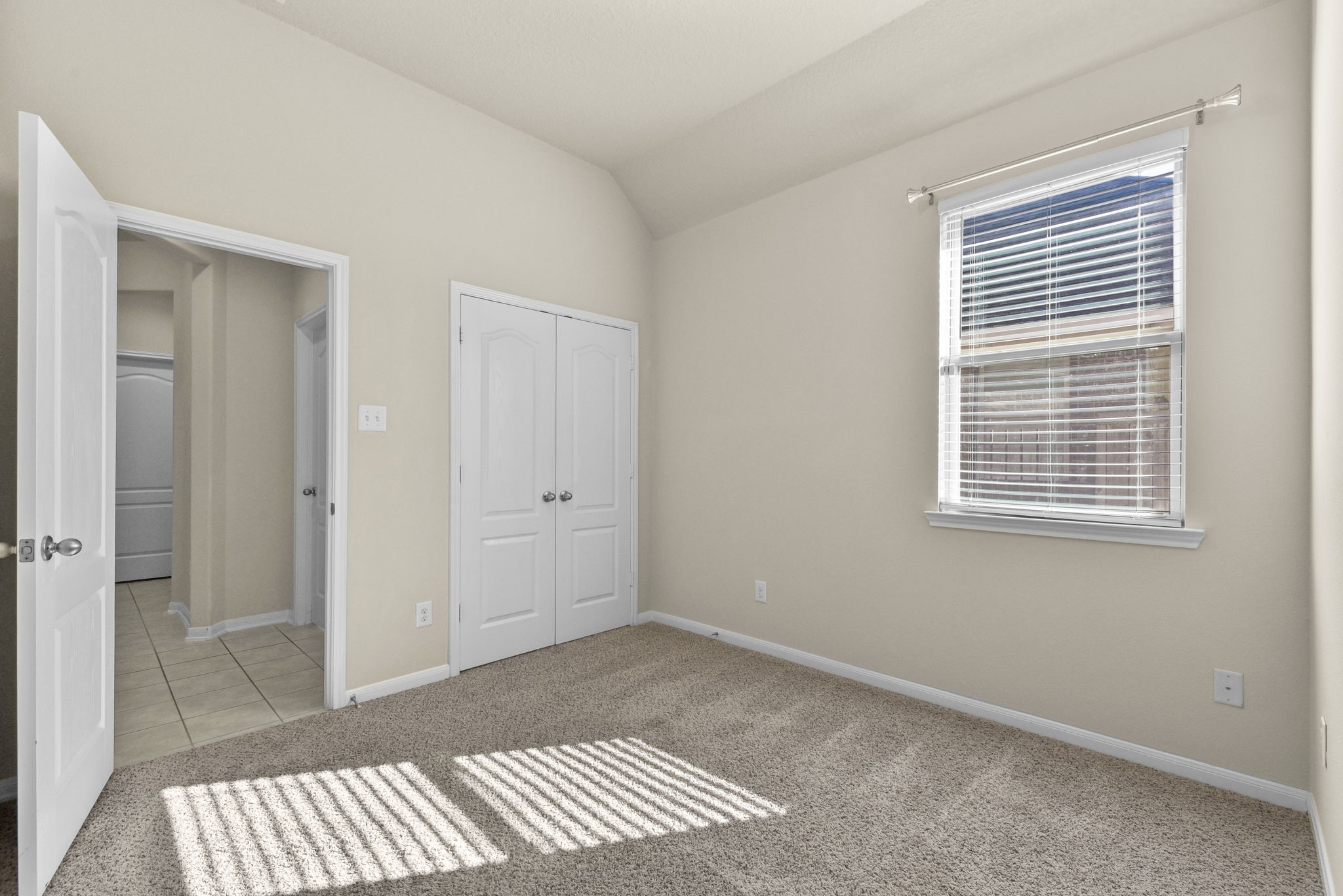 39 Butternut Grove Place Tomball, TX 77375 - Photo 25 of 35 a view of an empty room with glass door