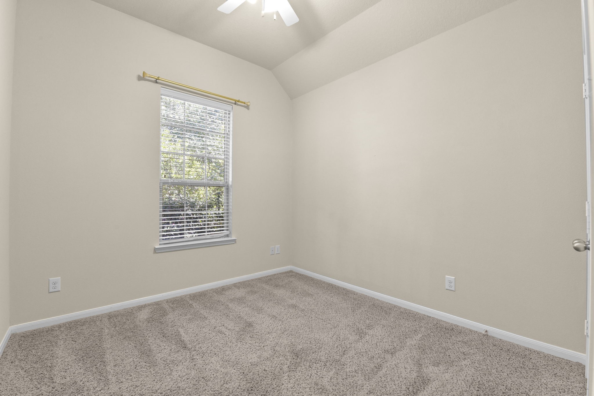 39 Butternut Grove Place Tomball, TX 77375 - Photo 27 of 35 an empty room with a window