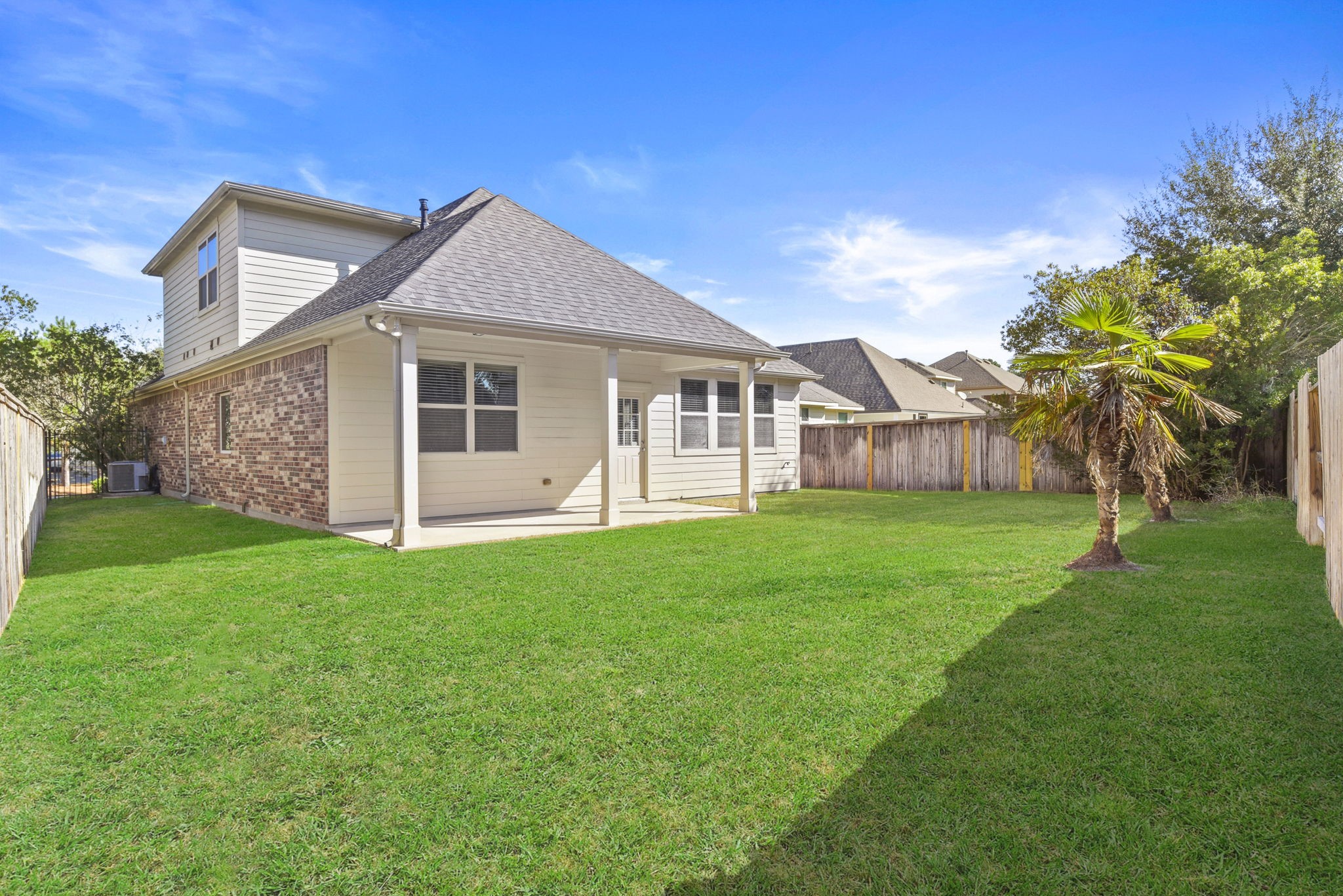 39 Butternut Grove Place Tomball, TX 77375 - Photo 33 of 35 a view of a house with a backyard