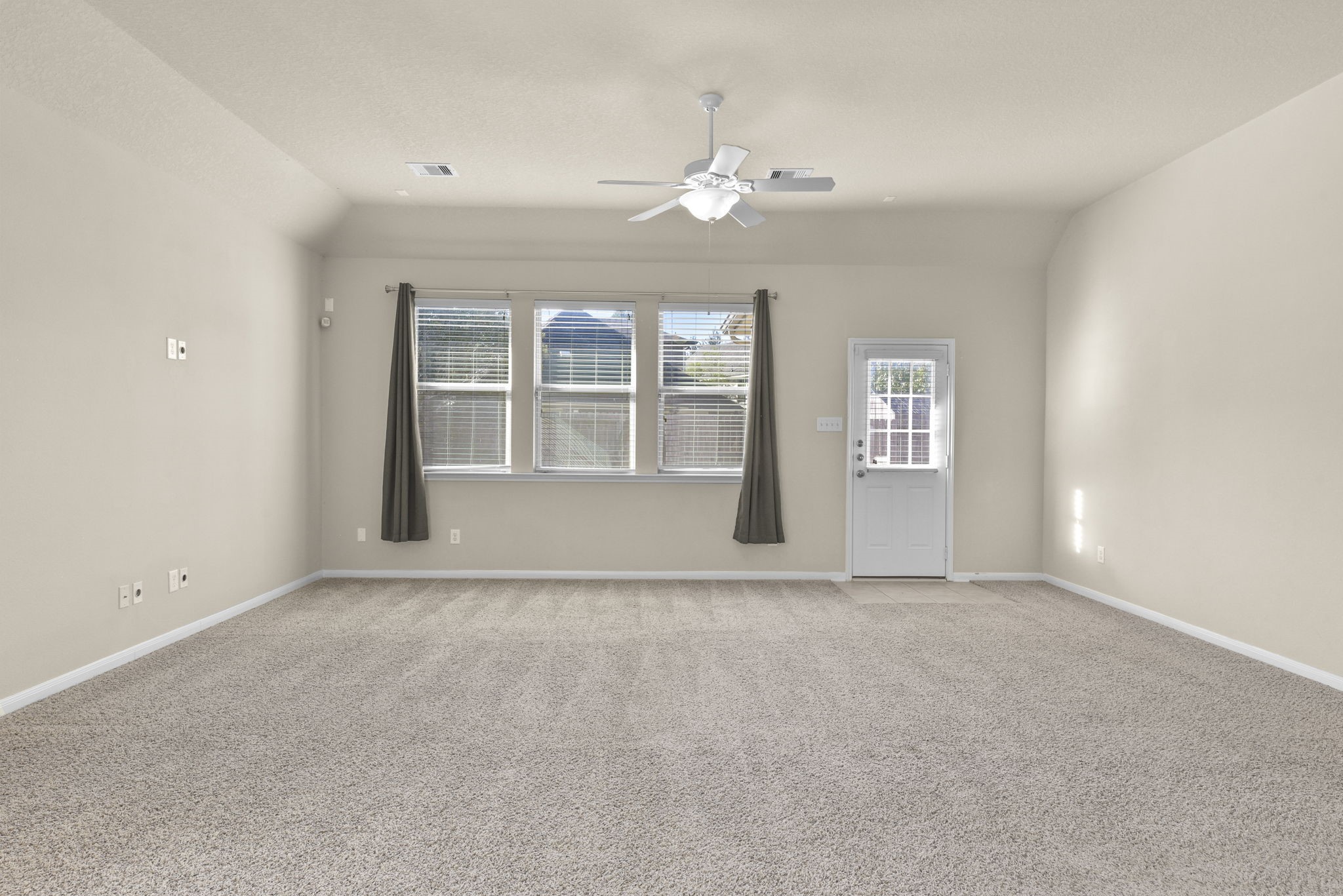 39 Butternut Grove Place Tomball, TX 77375 - Photo 4 of 35 a view of an empty room with a window