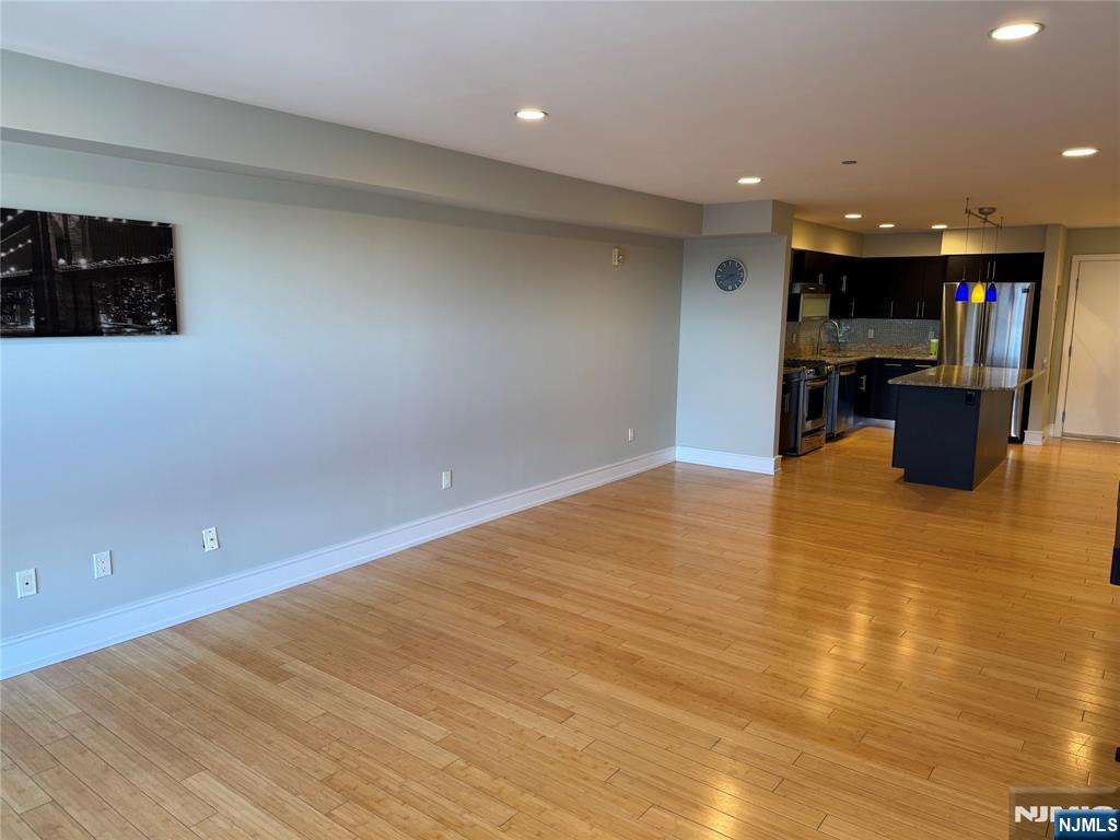 310 Cliff Lane, Unit 4E Cliffside Park, NJ 07010 - Photo 12 of 37 a view of a living room with kitchen