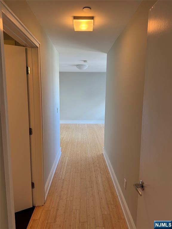 310 Cliff Lane, Unit 4E Cliffside Park, NJ 07010 - Photo 15 of 37 a view of a hallway with wooden floor