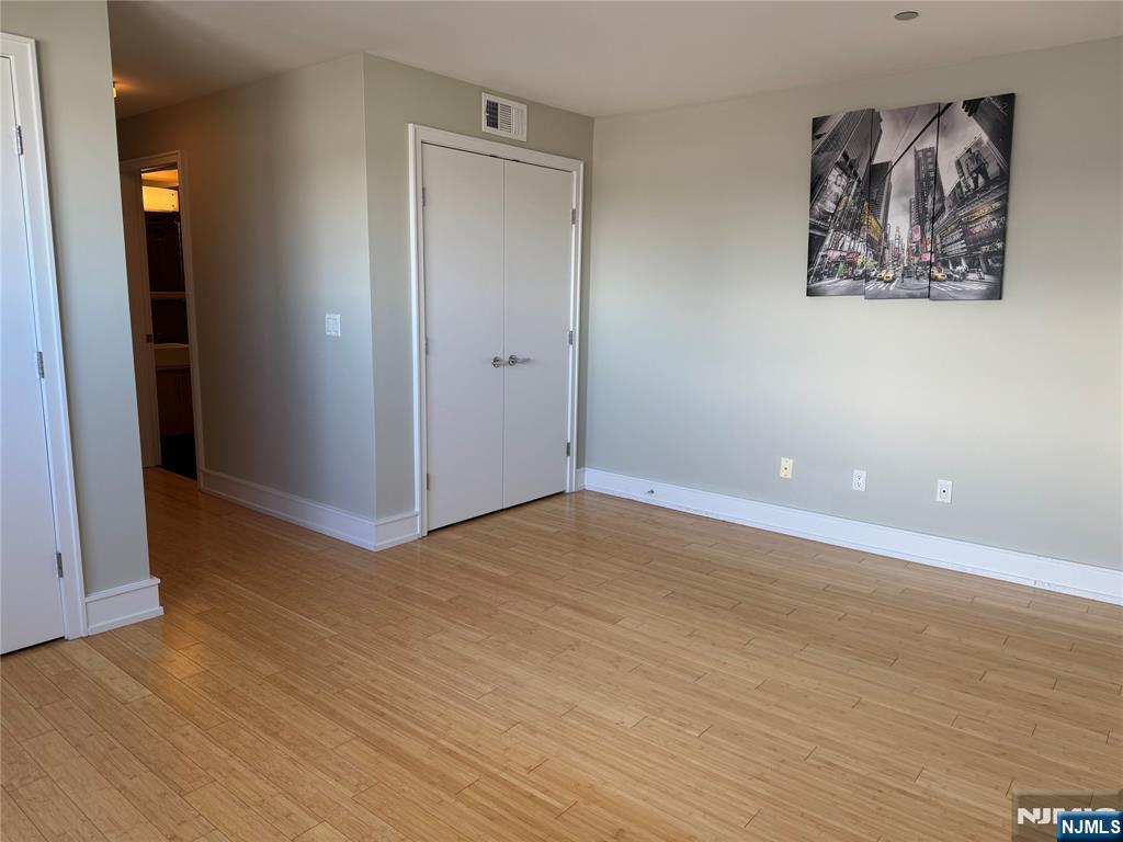 310 Cliff Lane, Unit 4E Cliffside Park, NJ 07010 - Photo 19 of 37 wooden floor in an empty room