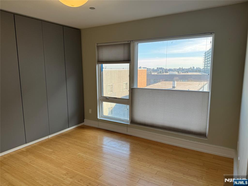 310 Cliff Lane, Unit 4E Cliffside Park, NJ 07010 - Photo 27 of 37 a view of an empty room with a window