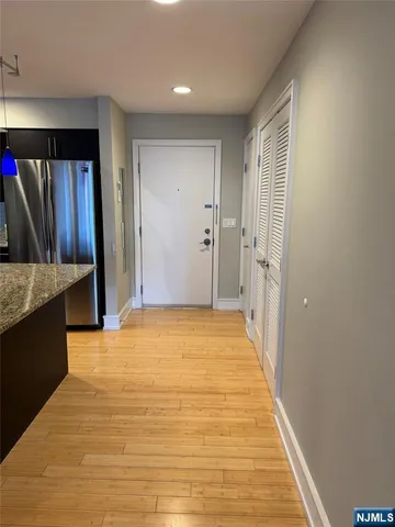 a view of livingroom with kitchen and furniture