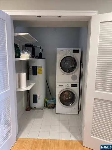 a utility room with sink dryer and washer