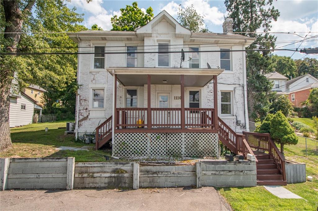 a view of a house with a roof deck