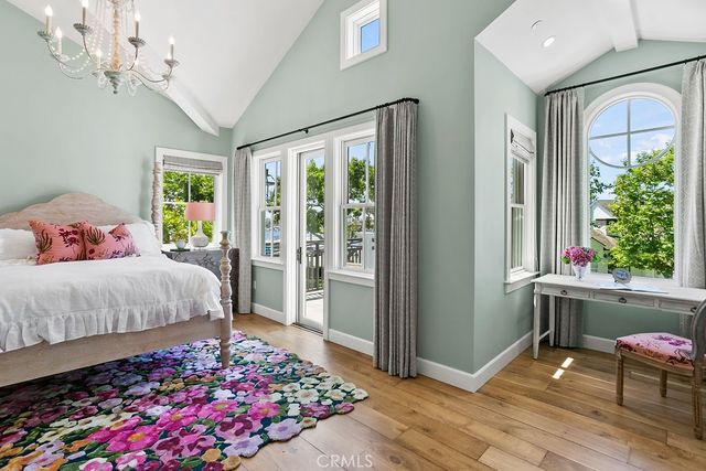 a bedroom with a bed and a balcony