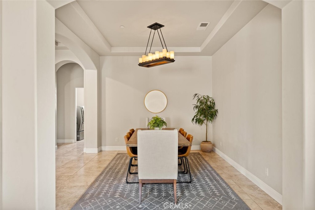 3368 Summit Ridge Terrace Chico, CA 95928 - Photo 17 of 44 a dining room with a table and a chandelier