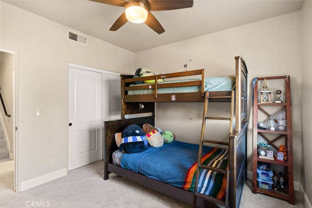 3368 Summit Ridge Terrace Chico, CA 95928 - Photo 26 of 44 a bedroom with furniture and a book shelf