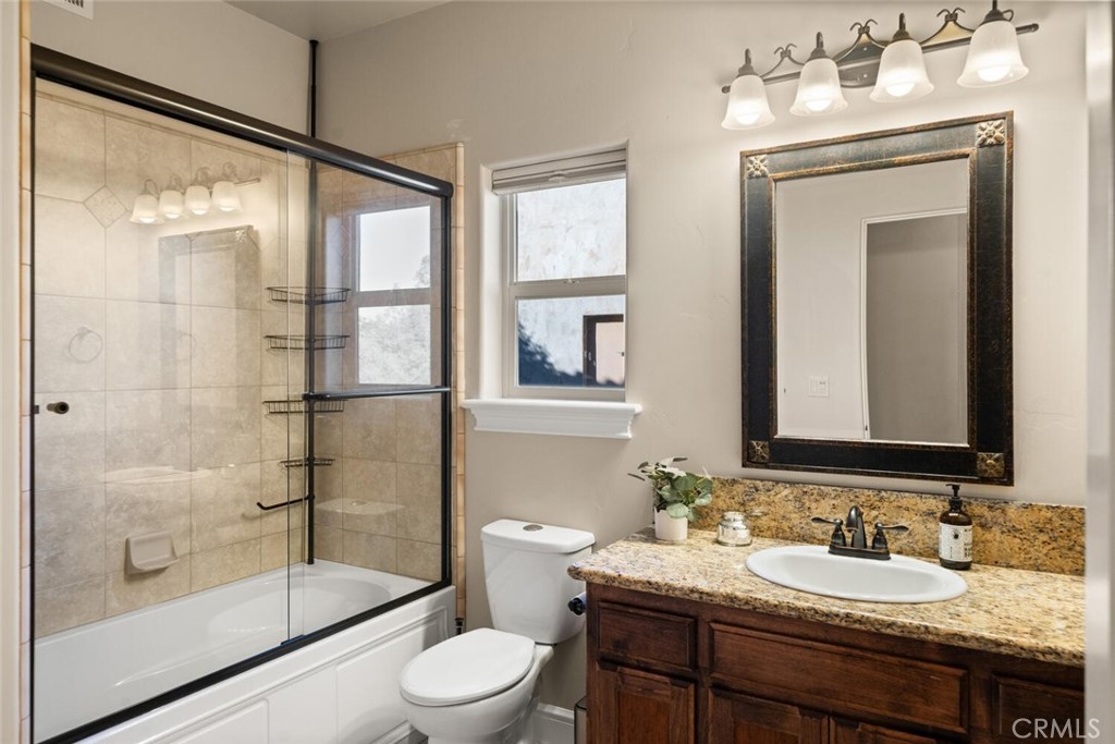 3368 Summit Ridge Terrace Chico, CA 95928 - Photo 27 of 44 a bathroom with a sink a toilet and shower