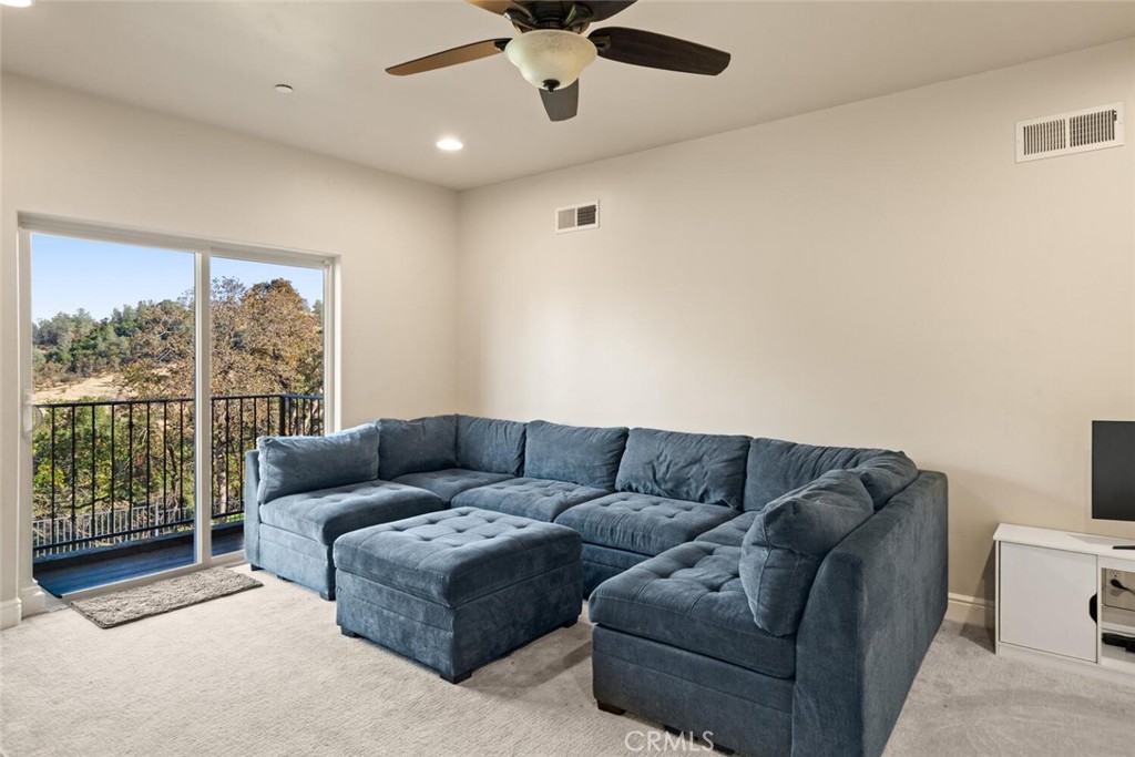 3368 Summit Ridge Terrace Chico, CA 95928 - Photo 28 of 44 a living room with furniture and a window