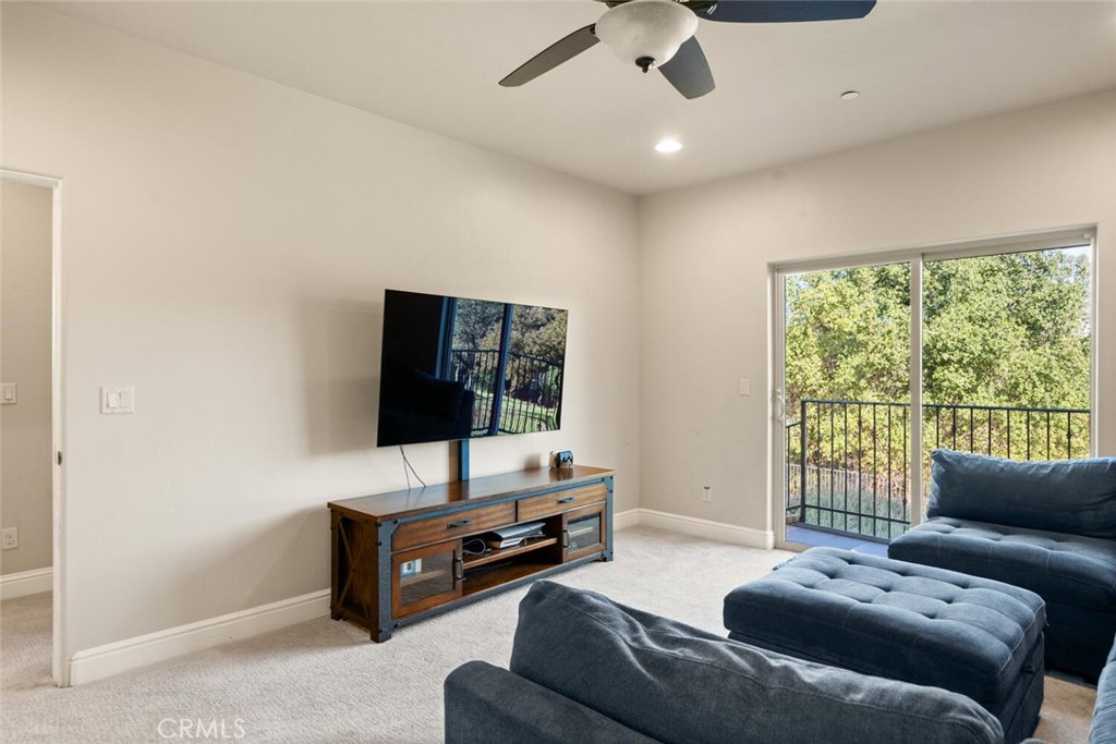 3368 Summit Ridge Terrace Chico, CA 95928 - Photo 29 of 44 a living room with furniture and a flat screen tv