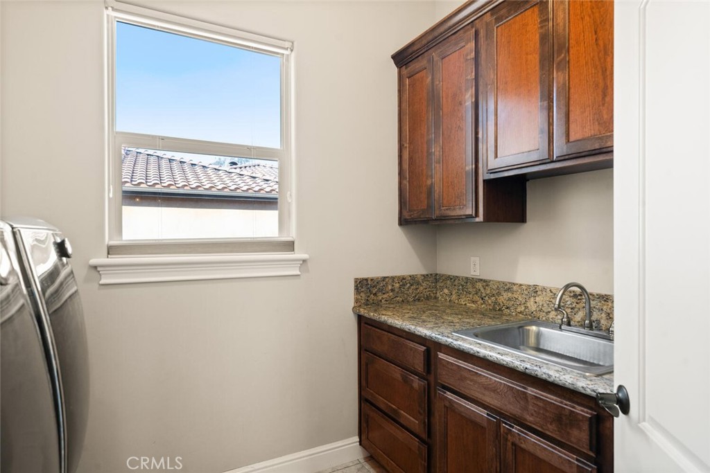 3368 Summit Ridge Terrace Chico, CA 95928 - Photo 30 of 44 a kitchen with stainless steel appliances granite countertop a refrigerator and a stove top oven