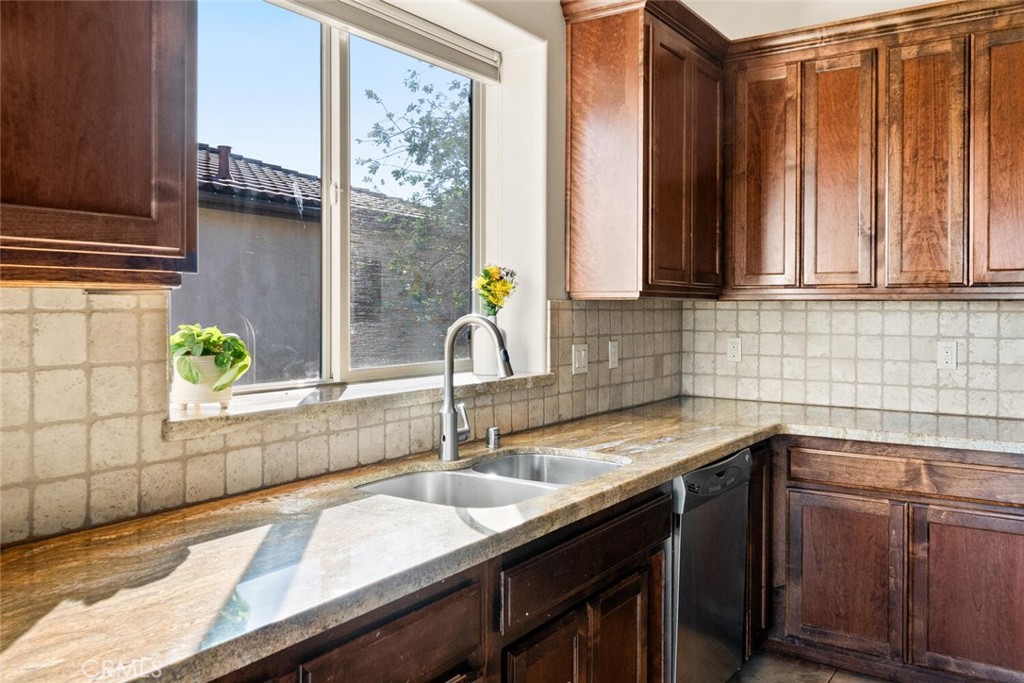 3368 Summit Ridge Terrace Chico, CA 95928 - Photo 9 of 44 a kitchen with granite countertop a sink and a window